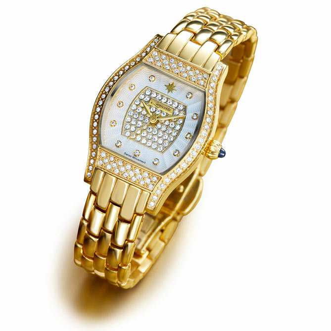 Reloj de oro de mujer Femenine: 11 diamantes marcando las horas, 146 auténticos cristales de Swarovski iluminando dial y bisel, cabujón de zafiro y oro.